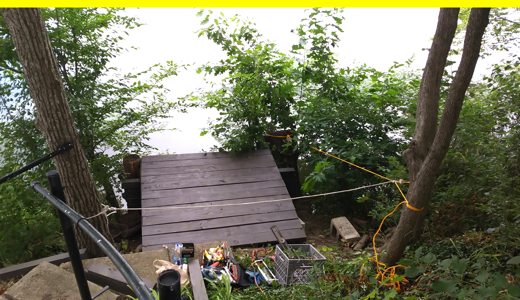 You'd like a deck just above the waterline 25 feet down a steep hill? No problem!